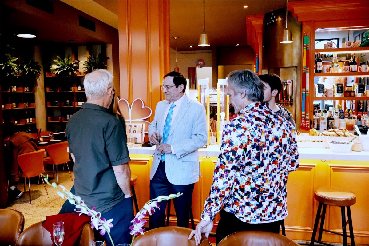 Guests mingling by the bar before dinner